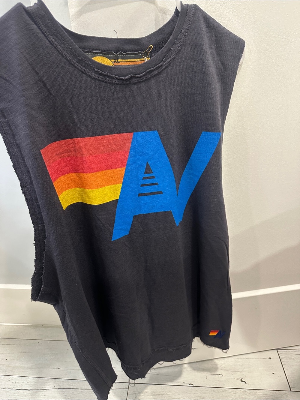 NWT Aviator Nation Black Tank with Blue 'AV' and Red-Orange-Yellow Stripe